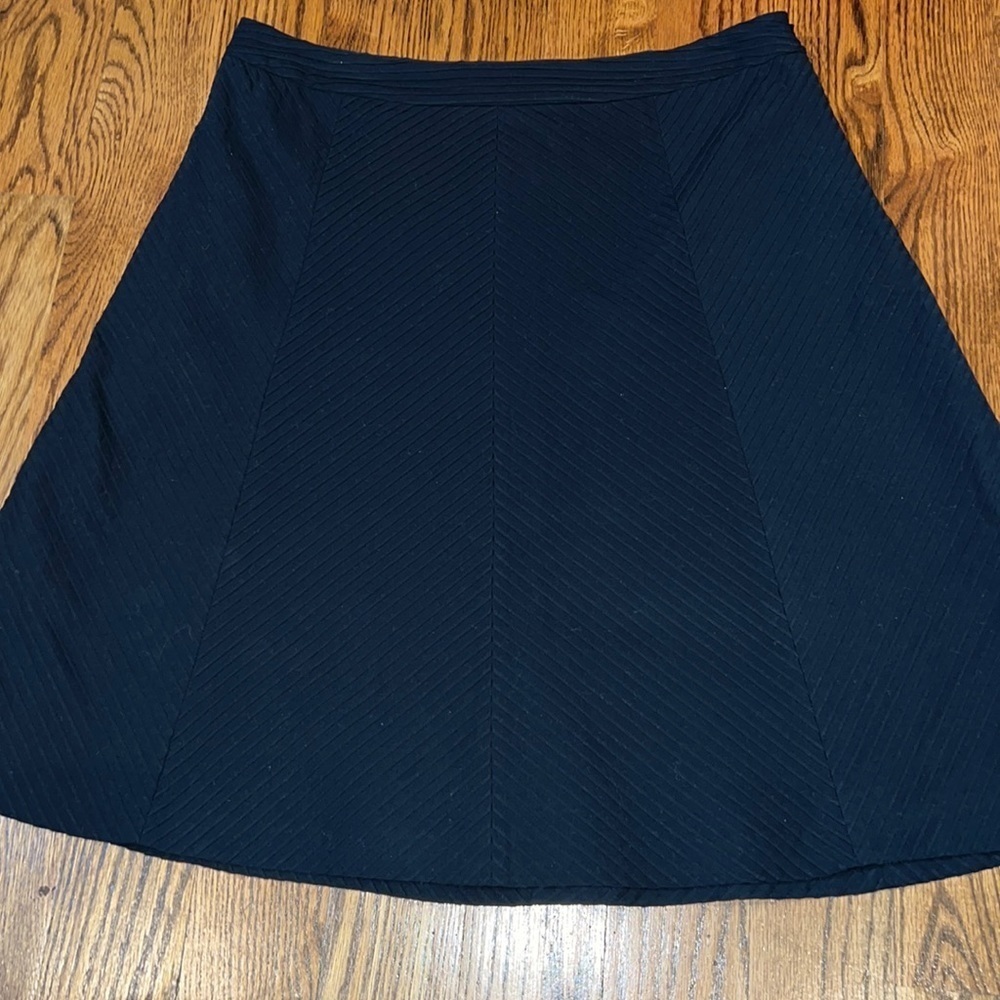 Banana Republic black a-line skirt. Ribbed detail size 10. NWOT.
